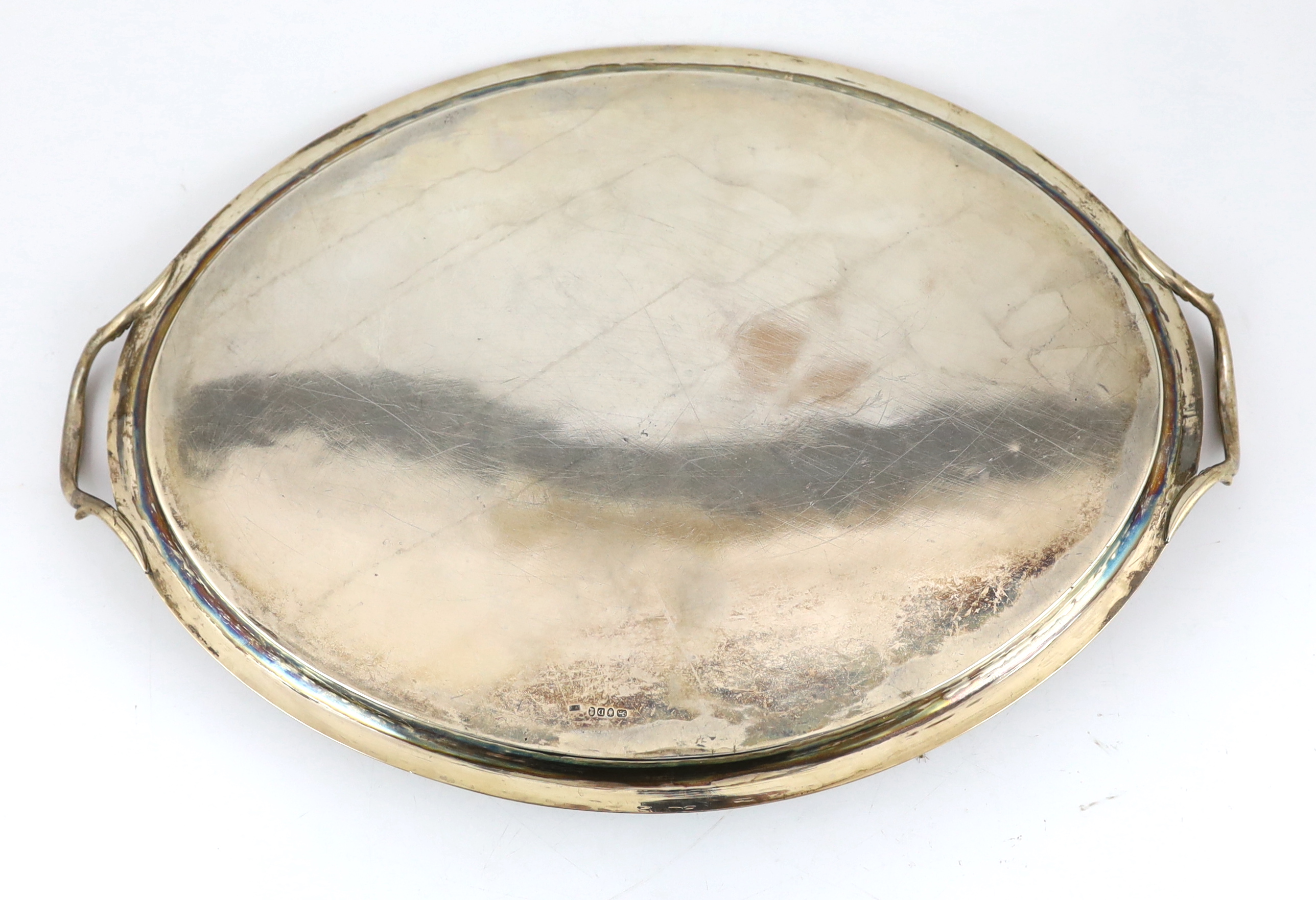 A George III silver oval two handled tea tray by William Bennett